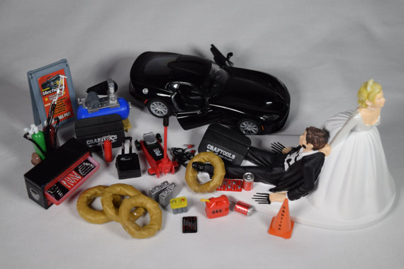 funny-auto-mechanic-car-loving-groom-being-dragged-by-bride-wedding-cake-topper-with-2013-black-srt-viper-gts-car.jpg